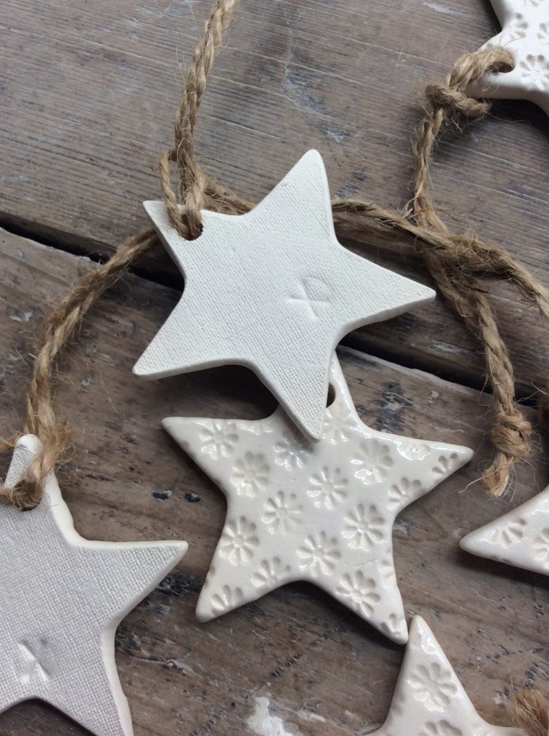 Handmade ceramic white star ornament with daisy design. Christmas gift tags, decorations, wedding, favours. Made with white clay image 3