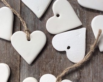 Handmade ceramic white heart ornament. For Christmas, gift tags, birthday, wedding, favours, made with white clay
