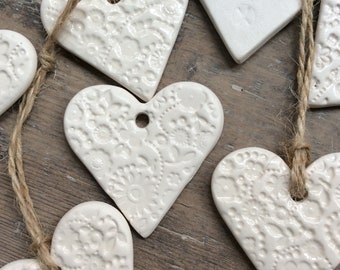Handmade Ceramic white heart ornament, with lace flower design. Christmas gift tags, decorations, Birthday, wedding favours