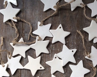 Handmade ceramic white star ornament. Christmas gift tags, decorations, wedding, favours, party.