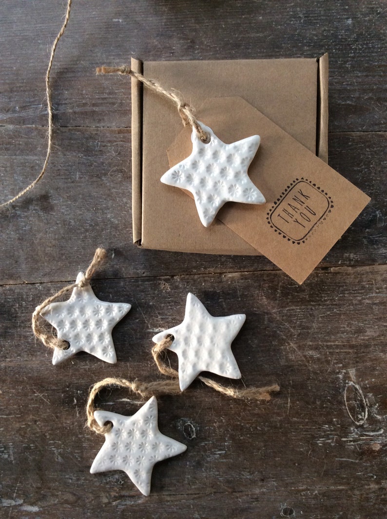 Handmade ceramic white star ornament with daisy design. Christmas gift tags, decorations, wedding, favours. Made with white clay image 1