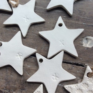 Handmade ceramic white star ornament with daisy design. Christmas gift tags, decorations, wedding, favours. Made with white clay image 8