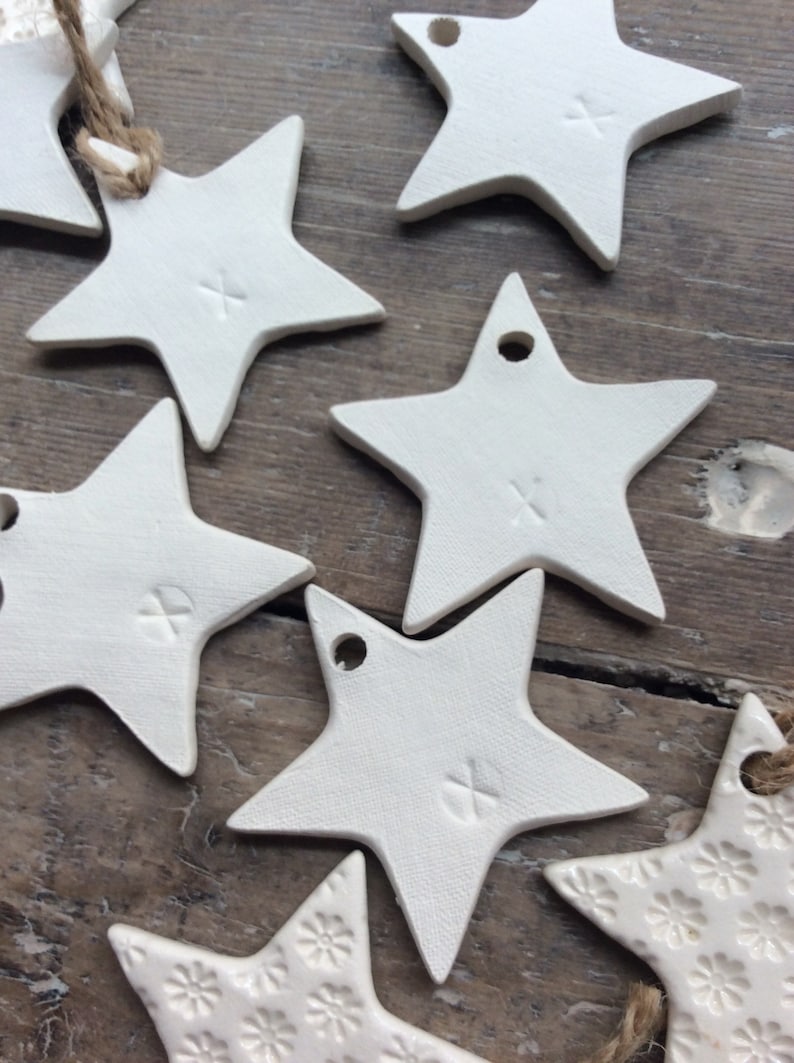 Handmade ceramic white star ornament with daisy design. Christmas gift tags, decorations, wedding, favours. Made with white clay image 8