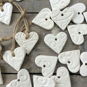 Handmade Ceramic hanging white stars and swirls heart ornament. Christmas gift tags, decorations, Valentine's Day, wedding favours