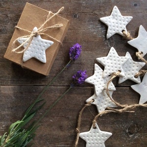 Handmade ceramic white star ornament with dots design. Christmas gift tags, decorations, wedding, favours. Made with white clay