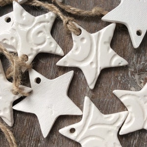 Handmade ceramic white star ornament, with swirls & stars. Christmas gift tags, decorations, wedding, favours. Made with white clay