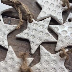 Handmade ceramic white star ornament with daisy design. Christmas gift tags, decorations, wedding, favours. Made with white clay image 2