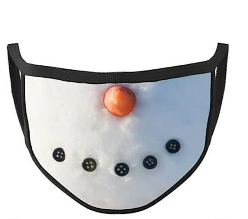 May include: A white face mask with a snowman design. The snowman has a black mouth, black eyes, and an orange nose.
