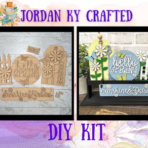 May include: A DIY craft kit featuring a wooden sign with the text "Sunshine & Daisies" and other spring-themed decorations, including a "hello spring" sign, a flower, and a fence.