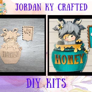 May include: DIY kits featuring a Highland cow in a honey pot design. The kits include a wooden cow, honey pot, and a small door with a bee. The word "HONEY" is visible on the pot. The text "JORDAN KY CRAFTED" and "DIY KITS" are also visible.