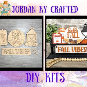 May include: DIY kits featuring wooden fall-themed decorations. The kits include cutouts of candles, a lantern, pumpkins, and the text "Hello Fall" and "Fall Vibes". The designs are in natural wood tones and are ready to be painted.