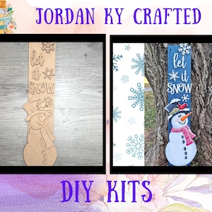 May include: Two DIY snowman kits. One is unfinished wood, the other is painted blue with a snowman design. Both have the text "let it snow". The kits are for crafting and decorating.