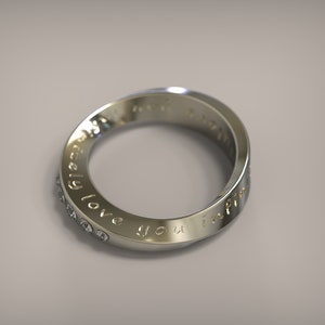 May include: A silver ring with a row of small diamonds and the inscription "infinitely love you infinite" around the band.