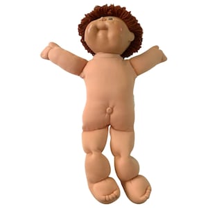 May include: A vintage Cabbage Patch Kid doll with brown hair and a nude body. The doll is posed with its arms outstretched and legs bent.