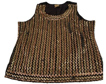 May include: A sleeveless sequined top with a black base and gold and rose gold sequins arranged in a chevron pattern.
