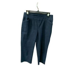 May include: Dark blue denim cropped pants with a pull-on waistband and two front pockets.