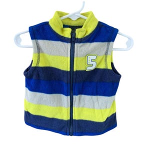 May include: A blue, yellow, and gray striped fleece vest with a zipper closure. The vest has a number "5" on the front.