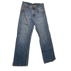 May include: A pair of blue denim jeans with a faded look and distressed details. The jeans have a straight leg fit and a classic five-pocket style.