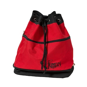 May include: Red and black drawstring backpack with a zippered pocket and black drawstring closure. The bag has the text "Jumer's Casino & Hotel" printed in black on the front.