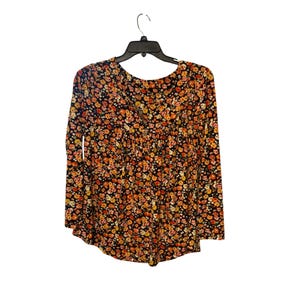 May include: A long-sleeved blouse with a floral pattern in shades of orange, yellow, and red on a black background. The blouse is hanging on a black hanger against a white background. The fabric appears to be lightweight.