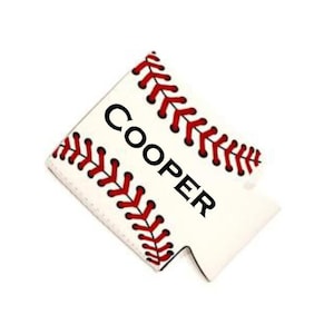 May include: White baseball-themed can cooler with red stitching and the name "COOPER" printed in black.