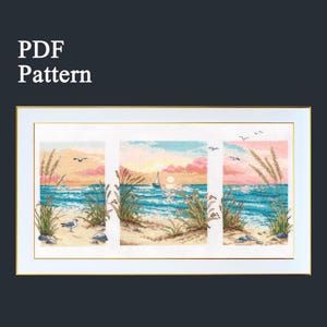 May include: A framed cross-stitch pattern depicting a beach scene with a sunset, ocean waves, and seagrass. The artwork is divided into three panels and features a sailboat, birds, and the text "PDF Pattern" in the upper left corner.