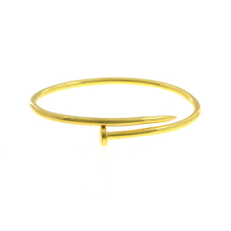 Bracciale rigido tubolare contrari\u00e8 chiodo placcato oro giallo in argento 925\u2030