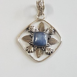 Beautiful floral themed Sterling silver carved Lapis pendant , 92.5 purity , pendant size - 4.25×3.25 cm