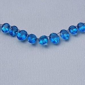 London B.t. color coated Topaz oval facetted 9x7mm to 10x8mm