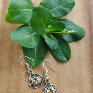 Citrine with peridot facetted cut stone studded in sterling silver earrings,antique polish carved,silver ear wire,22*14mm size ,92.5 purity