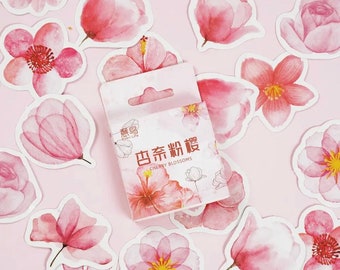 May include: A pack of pink and white cherry blossom stickers. The stickers are in a small box with the text "Cherry Blossoms" on the front. The stickers are perfect for adding a touch of spring to your planner, journal, or scrapbook.