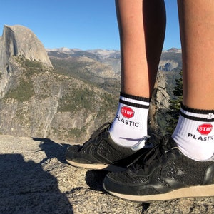 White Socks with inscription Stop Plastic, for ecology, green planet