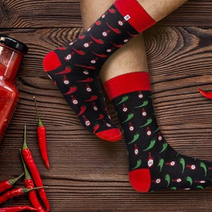 Socks with different colour Chili Pepper and hot sauce