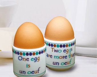 Pair of funny 'oeuf' bone china EGG CUPS