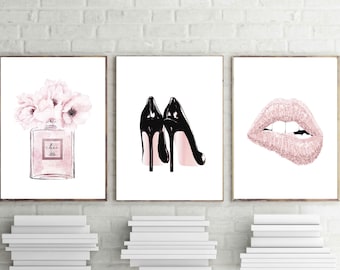 May include: Three framed prints with a pink and white floral design, a pair of black high heels, and a pair of pink lips with glitter.