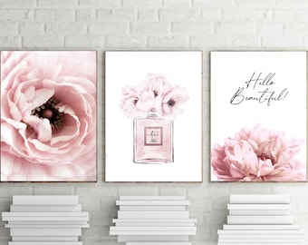 May include: Three pink floral prints with the text "Hello Beautiful!" on one print. The middle print features a pink floral bouquet with a perfume bottle labeled "chic".