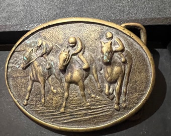 Race horses belt buckle.