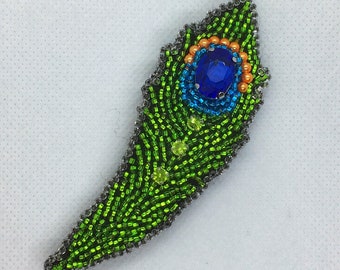 Peacock feather brooch