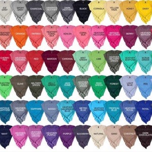 May include: A collection of various colored t-shirts, each labeled with its color name. Colors include white, black, yellow, red, blue, green, and many heathered shades. The shirts are displayed in rows, showcasing a wide range of options.
