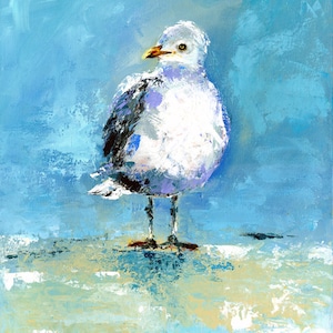 May include: An original painting of a seagull. The bird is depicted with white, gray, and black feathers, a yellow beak, and orange feet. The background is a blend of blue and white brushstrokes, creating a textured effect. The artwork is signed by the artist.