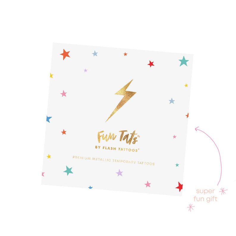 May include: A white card with a gold lightning bolt and the text "Fun Tats by Flash Tattoos" and "Premium Metallic Temporary Tattoos". The card is decorated with colorful stars.
