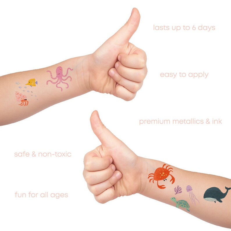 May include: Two children's arms with temporary tattoos of sea creatures. The tattoos include an octopus, a crab, a turtle, a fish, a jellyfish, and a whale. The text on the image reads "safe & non-toxic", "fun for all ages", "lasts up to 6 days", "easy to apply", and "premium metallics & ink".