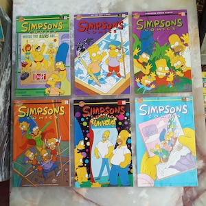 May include: Six Simpsons Comics issues featuring colorful illustrated covers. Titles include Where the Beers Are, Art for Bart's Sake, Simpsons Under Glass, Fun House, and TV View. The covers display various characters like Homer, Bart, Marge, and Lisa.