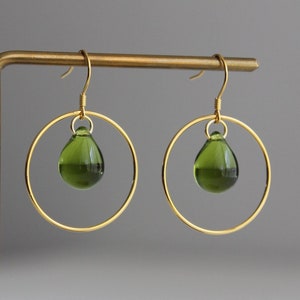 Gold plated over silver hoop earrings with peridot green / olive green glass teardrops