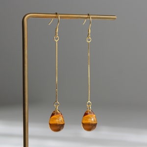 Gold plated over silver chain amber color teardrop earrings