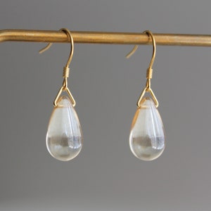 Clear and gold two tone glass teardrop earrings with gold plated over silver ear wires