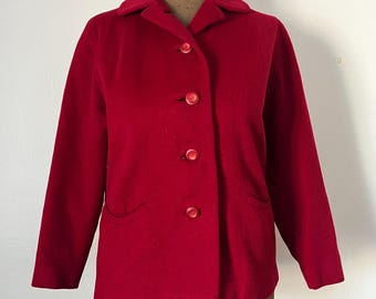May include: A red wool blazer with a classic collar and five red buttons. The blazer has two pockets on the front.