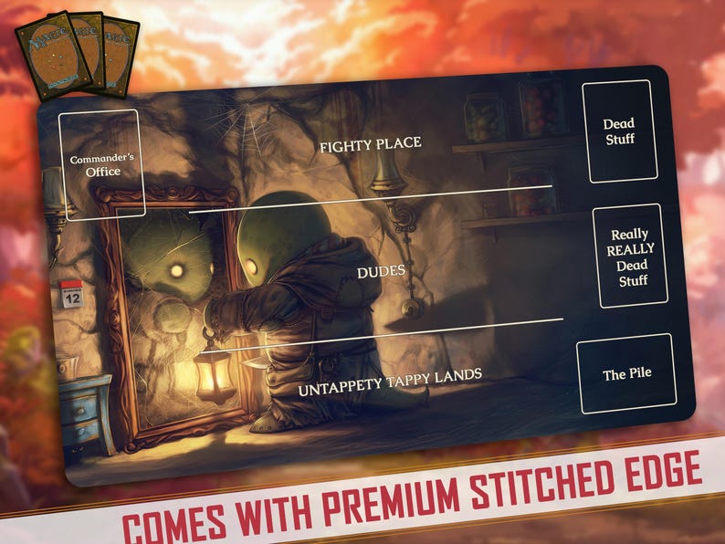 May include: A black and white illustrated game mat with a fantasy theme. The mat features a mirror, a character, and various game zones labeled "Commander's Office", "Fighty Place", "Dudes", "Untappety Tappy Lands", "Dead Stuff", "Really Really Dead Stuff", and "The Pile".