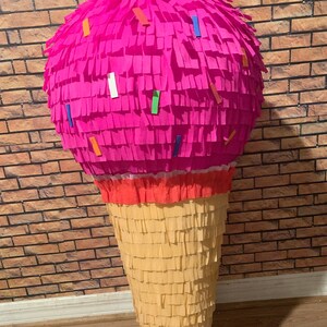 May include: A set of three ceramic mugs with a speckled, matte finish. The mugs are in shades of blue, green, and white. Each mug has a simple, modern design, perfect for coffee or tea. The mugs are stacked on top of each other.