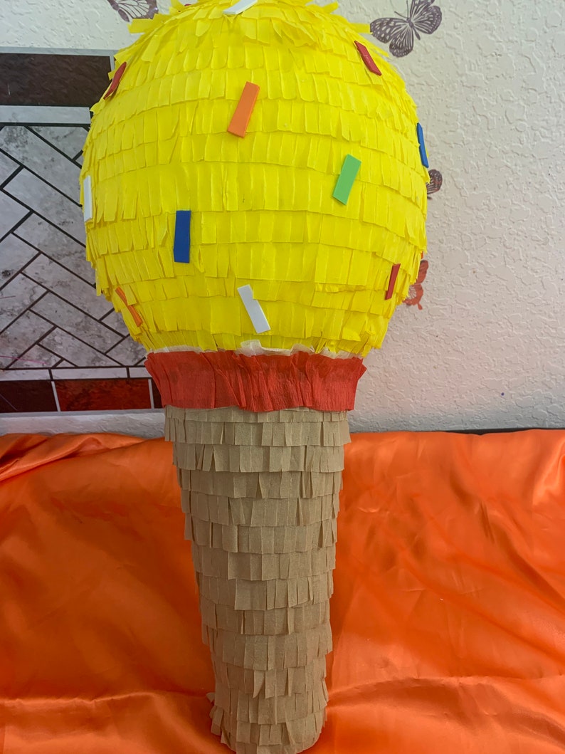 May include: A set of three ceramic mugs with a speckled, matte finish. The mugs are in shades of cream, light gray, and dark gray. Each mug has a simple, minimalist design, perfect for coffee or tea.